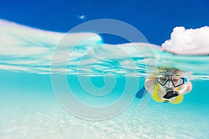 Woman snorkeling in tropical water