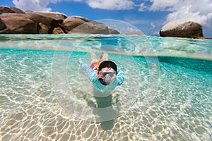 Woman snorkeling in tropical water