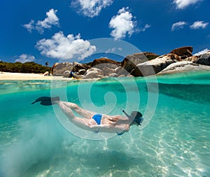 Woman snorkeling at tropical water