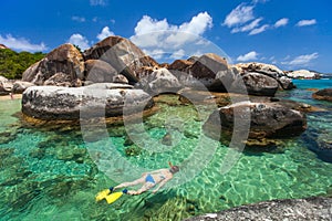 Woman snorkeling at tropical water photo