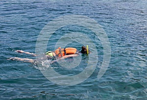 Woman snorkelling in andaman sea at phi phi islands, Thailand