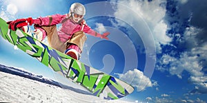 Woman snowboarder in air