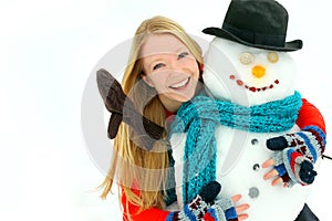 Woman and Snowman Outside in Winter