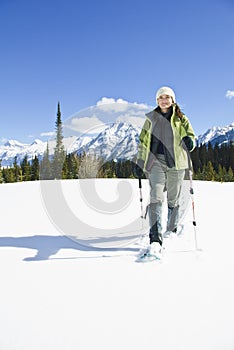 Woman snowshoeing in the Canadian rockies
