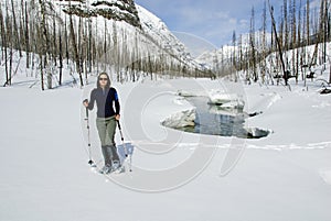 Woman snowshoeing in the Canadian rockies