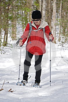 Woman Snowshoeing in the Woods