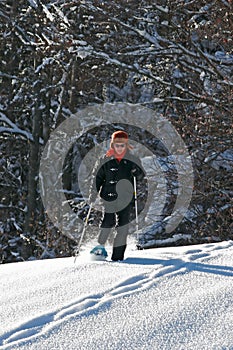 Woman with snowshoes photo