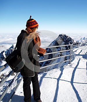 Woman on snowy mountain