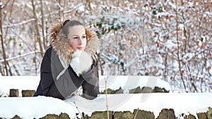Woman in snowy winter park