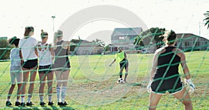 Woman, soccer and kicking ball for penalty, goal or scoring on green grass field in net. Female person or athlete in