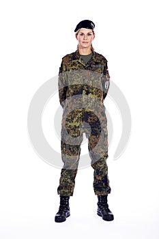 Woman soldier stands in attitude