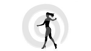 Woman solo dancing elements of ballroom dancing. Silhouette, slow motion