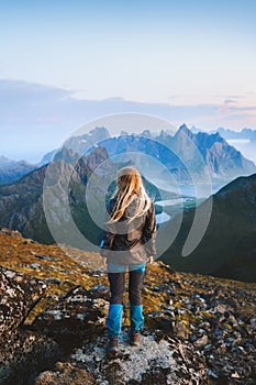 Woman solo traveler hiking in Norway exploring mountains of Lofoten islands tourist traveling outdoor alone