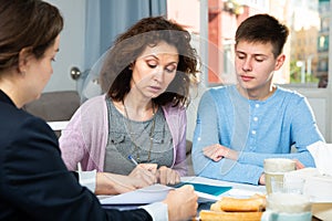 Woman with son meeting with tutor