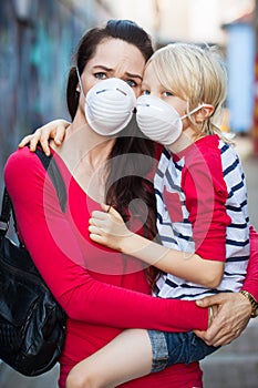 Woman and son wearing face masks