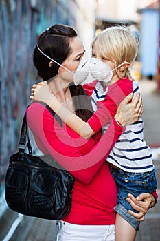 Woman and son wearing face masks