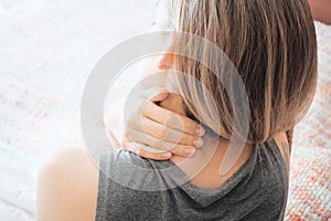 Woman with sore neck, neck pain photo