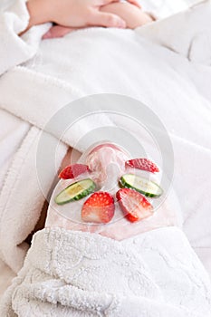 A woman at the spa with a faci