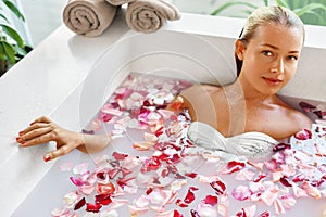 Woman Spa Flower Bath. Aromatherapy. Relaxing Rose Bathtub. Beauty