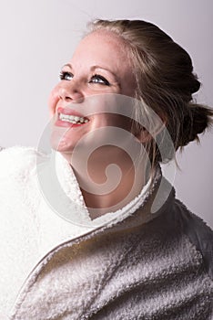 Woman at the spa looking up to the light