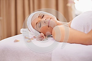 Woman, spa and rest for zen, wellness and peace with relaxation and calm. Lady, towel and massage table at resort