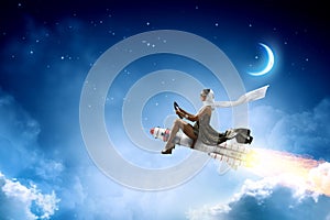 Woman on space rocket . Mixed media