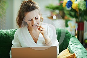 Woman speaking with dentist in modern living room in sunny day