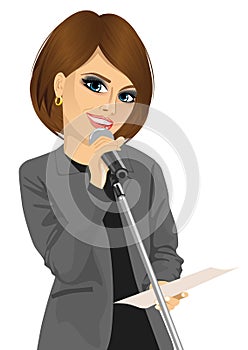 Woman speaking into a microphone