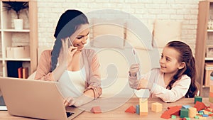 Woman Speaking Phone and Girl Play Smart Game.