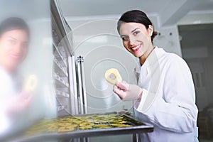 Woman Specialist in Food Quality and Health Control Checking Apples