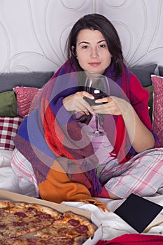 Woman spending evening in bed