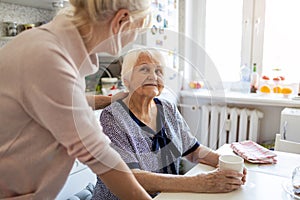 Woman spending time with her elderly mother