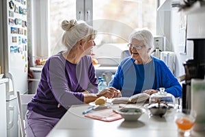 Woman spending time with her elderly mother