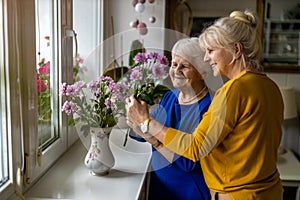 Woman spending time with her elderly mother