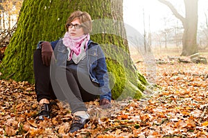 Woman spending time in park during autumn season