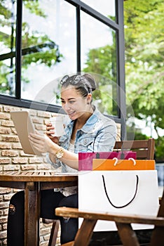 Woman spending time after shopping on the internet