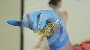 Woman is spinning sugar pasta in her hands