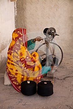 Woman spinning wool