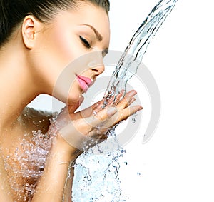 Woman with splashes of water in her hands
