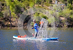 Woman Splashing Water on Paddle Board Stand Up Paddle-Board