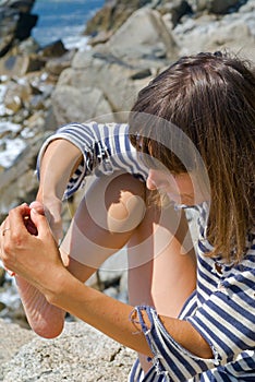 Woman with splinter in foot 1 photo