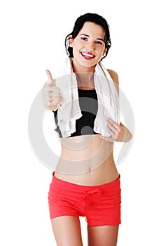 Woman in sport clothes gesturing thumbs up