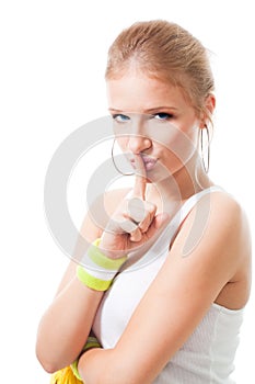 Woman in sport clothes make shh sign photo