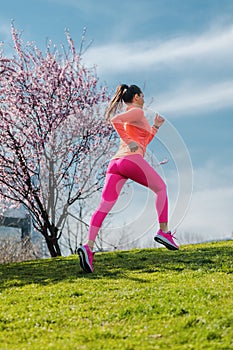 Woman sport running on hill for fitness