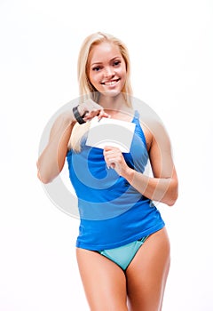 Woman in sport style standing against white background.