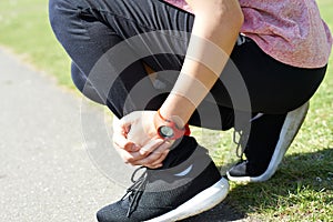 Woman With Sports Injury Sustained Whilst Jogging In Park