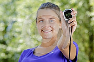 woman in sports showing chronometer