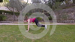 Woman in sports suit doing cardio exercises