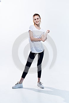 woman in sports uniform workout posing fitness light background