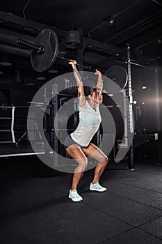 Woman in sportswear doing crossfit workout